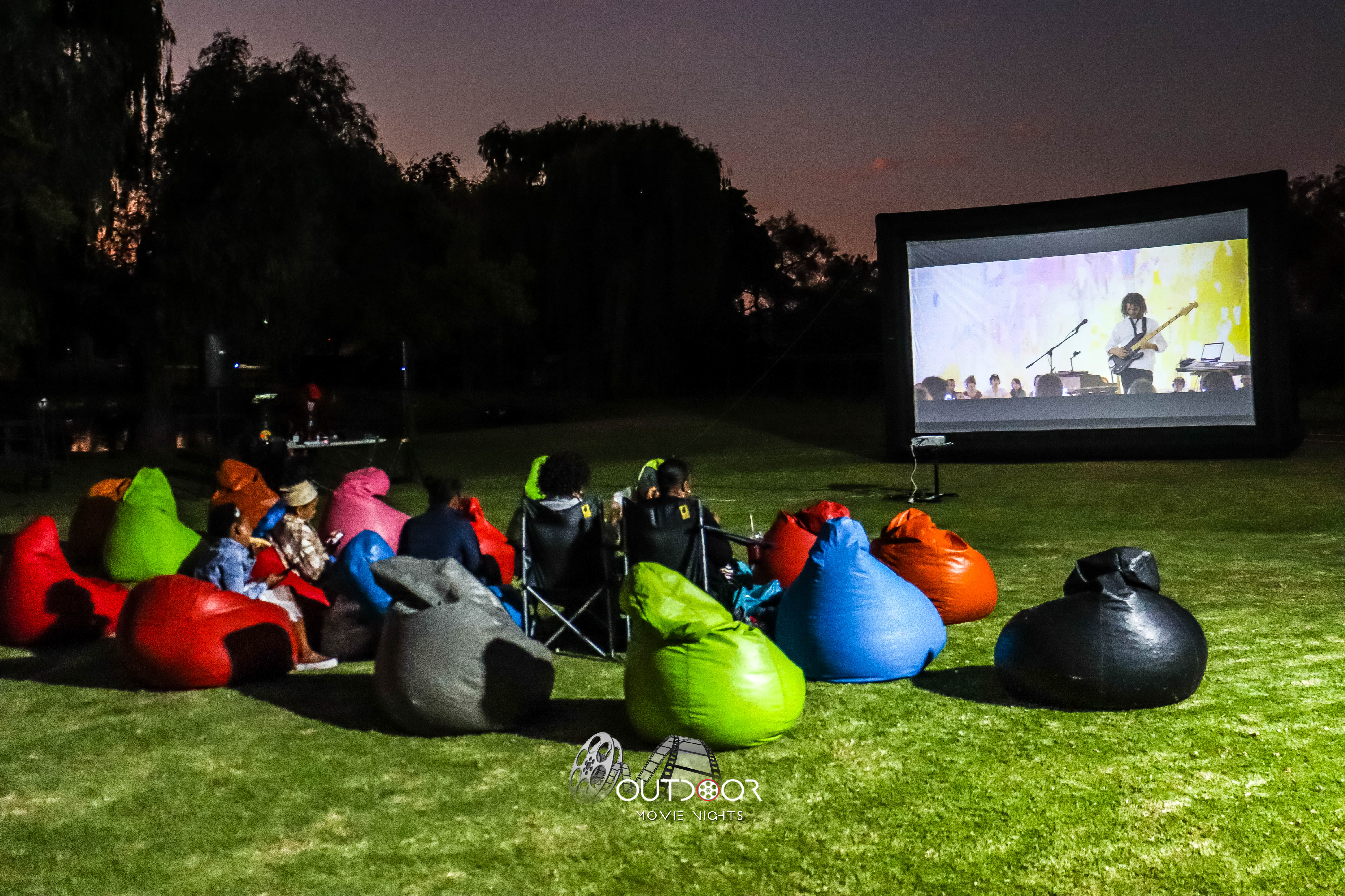 Bean bag cinema at night with glowing screen