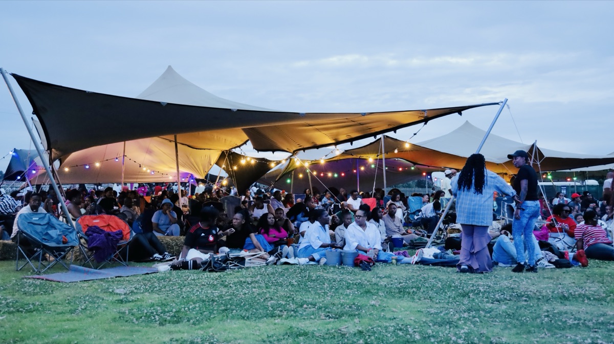 Crowd under string lights